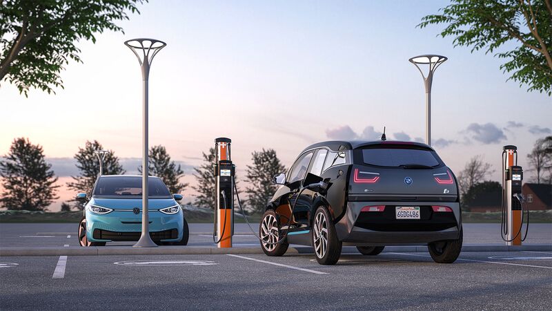 ChargePoint CP6000 stations in a workplace parking lot at dusk