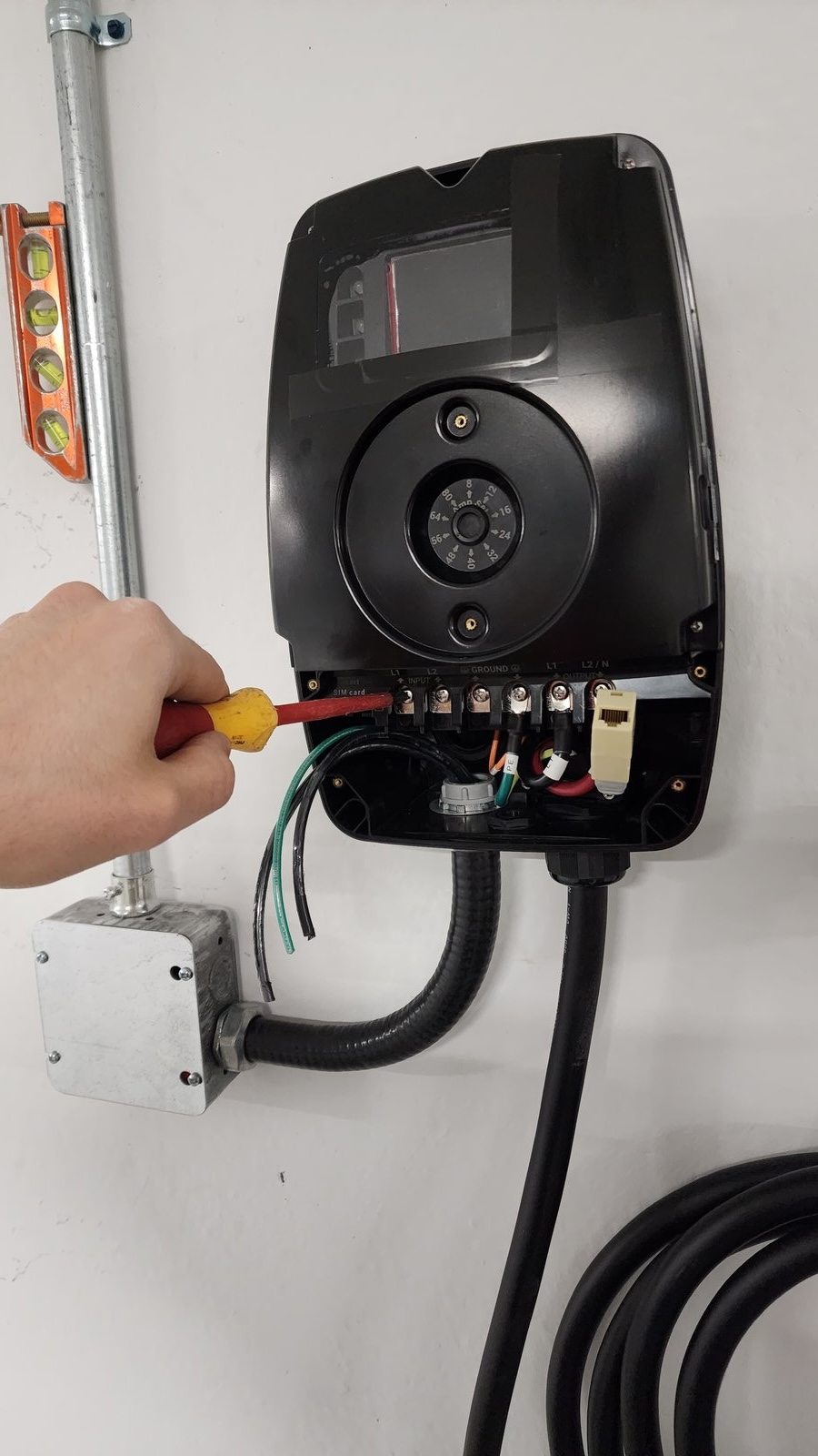 EV charger wiring and conduit work in a multi-residential building
