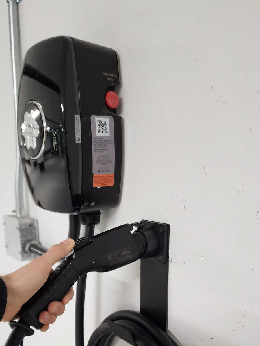 EV charger fed in EMT conduit and ready to use in a residential building parking garage
