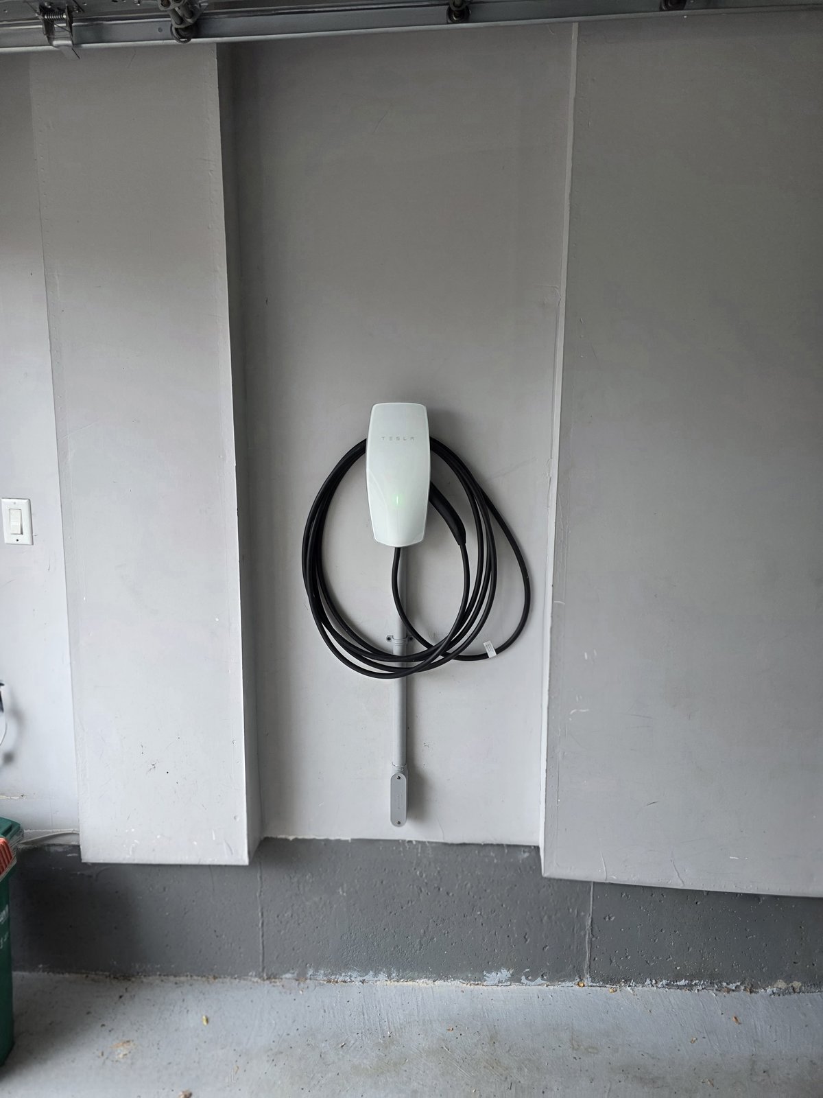 Tesla EV charger installed in residential garage